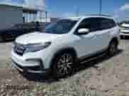 2021 Honda Pilot Touring 8-Passenger z VIN 5FNYF5H90MB001836, wystawiony jako Copart lot #61471875 z przebiegiem 83 813 mil mil oraz Szkoda całkowita • Salvage title. Historia ofert i sprzedaży dostępna na DreamBid. Obrazek 1.