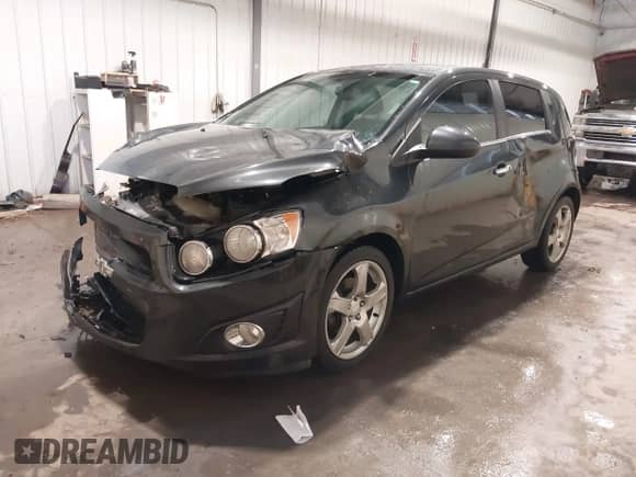 2014 Chevrolet Sonic LTZ with VIN 1G1JE6SB2E4130099, listed as a IAAI auction lot 41568613 with 133,572 mi miles and . Bid and sale history available at DreamBid. Image 2.