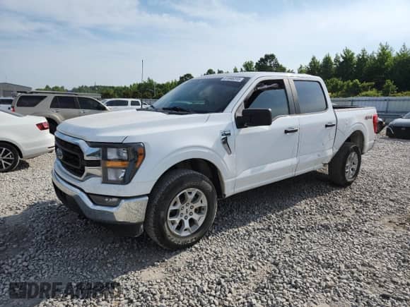 2023 Ford F-150 Lariat with VIN 1FTFW1E89PFA91516, listed as a Copart auction lot 61666315 with 65,711 mi miles and Salvage title. Bid and sale history available at DreamBid. Image 1.