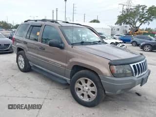 2001 Jeep Grand Cherokee Laredo with VIN 1J4GW48NX1C554595, listed as a IAAI auction lot 42110378 with 221,574 mi miles and . Bid and sale history available at DreamBid. Image 1.