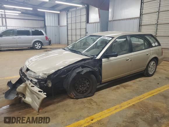 1998 Saturn SW with VIN 1G8ZK8278WZ195628, listed as a Copart auction lot 56502165 with 164,615 mi miles and Salvage title. Bid and sale history available at DreamBid. Image 1.