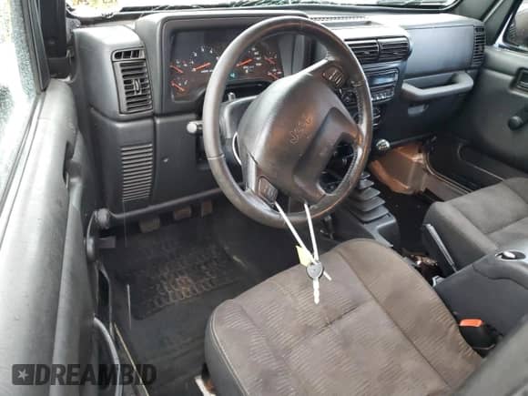 2003 Jeep Wrangler Rubicon с VIN 1J4FA69SX3P322715, выставлен на аукционе Copart как лот 63976635 с пробегом 167 842 миль миль и Списание • Salvage title. История ставок и продаж доступна на DreamBid. Изображение 8.