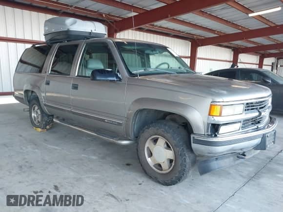 1999 Chevrolet Suburban with VIN 1GNFK16R0XJ516287, listed as a IAAI auction lot 43561423 with 264,526 mi miles and . Bid and sale history available at DreamBid. Image 1.