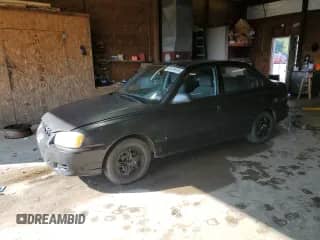 2000 Hyundai Accent z VIN KMHCG45G9YU127156, wystawiony jako Copart lot #63414815 z przebiegiem 91 446 mil mil oraz Czysty tytuł • Clean title. Historia ofert i sprzedaży dostępna na DreamBid. Obrazek 1.