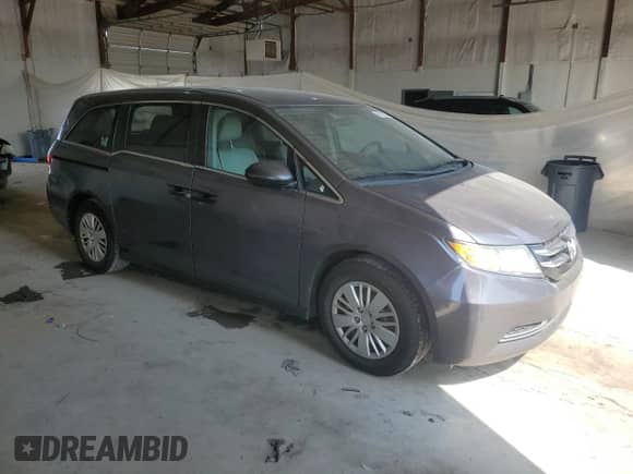 2015 Honda Odyssey LX with VIN 5FNRL5H24FB115955, listed as a Copart auction lot 61471335 with 114,741 mi miles and Salvage title. Bid and sale history available at DreamBid. Image 4.