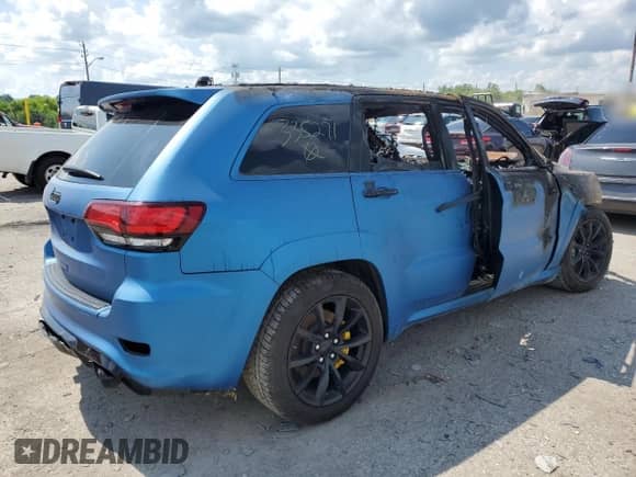 2018 Jeep Grand Cherokee Trackhawk z VIN 1C4RJFN97JC335271, wystawiony jako Copart lot #62872195 z przebiegiem Nie podano mil oraz Szkoda całkowita • Salvage title. Historia ofert i sprzedaży dostępna na DreamBid. Obrazek 3.