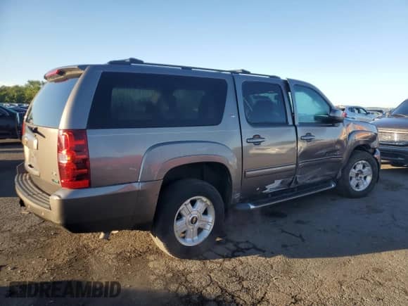 2011 Chevrolet Suburban LT z VIN 1GNSKJE33BR395289, wystawiony jako Copart lot #71931345 z przebiegiem 214 658 mil mil oraz Szkoda całkowita • Salvage title. Historia ofert i sprzedaży dostępna na DreamBid. Obrazek 3.