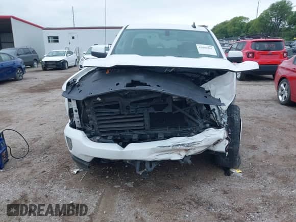 2018 Chevrolet Silverado 1500 LT z VIN 3GCUKREC8JG251610, wystawiony jako IAAI lot #42805361 z przebiegiem 111 857 mil mil oraz . Historia ofert i sprzedaży dostępna na DreamBid. Obrazek 12.