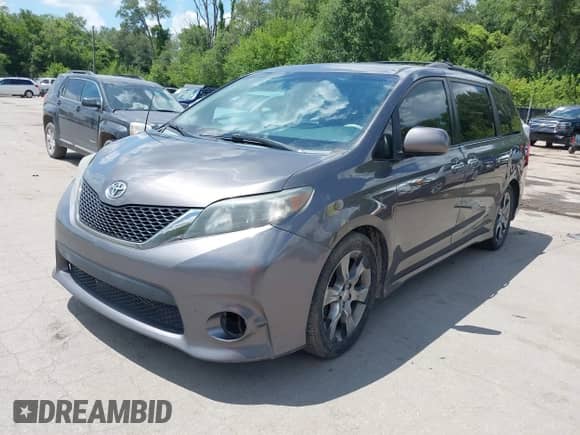 2014 Toyota Sienna SE with VIN 5TDXK3DC8ES443113, listed as a IAAI auction lot 42735795 with 235,269 mi miles and . Bid and sale history available at DreamBid. Image 2.