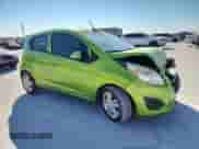 2014 Chevrolet Spark LS with VIN KL8CB6S94EC565436, listed as a Copart auction lot 86057295 with 106,927 mi miles and Salvage title. Bid and sale history available at DreamBid. Image 4.