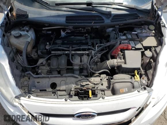 2013 Ford Fiesta S z VIN 3FADP4TJ5DM215407, wystawiony jako Copart lot #55306645 z przebiegiem 91 942 mil mil oraz Szkoda całkowita • Salvage title. Historia ofert i sprzedaży dostępna na DreamBid. Obrazek 11.