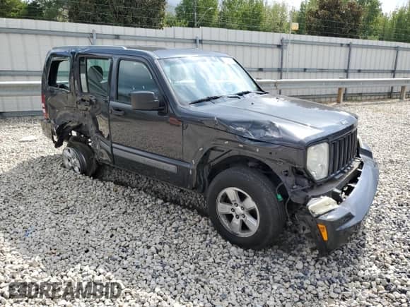 2011 Jeep Liberty Sport with VIN 1J4PN2GK7BW560109, listed as a Copart auction lot 82042155 with 145,599 mi miles and Salvage title. Bid and sale history available at DreamBid. Image 4.