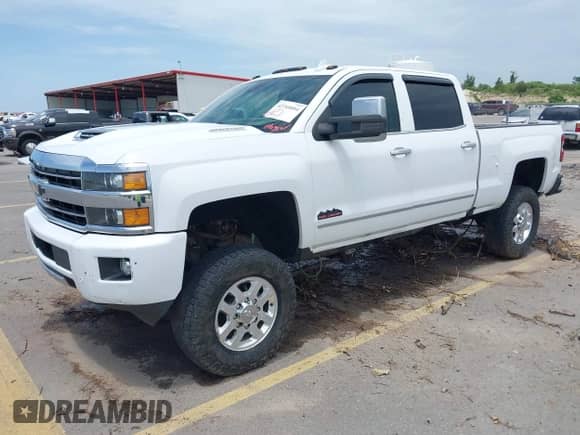 2018 Chevrolet Silverado 2500HD High Country z VIN 1GC1KXEY6JF199771, wystawiony jako IAAI lot #42709894 z przebiegiem 158 571 mil mil oraz . Historia ofert i sprzedaży dostępna na DreamBid. Obrazek 2.