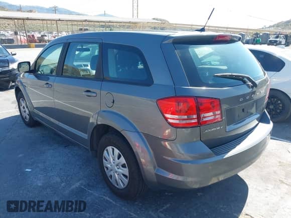 2012 Dodge Journey SE z VIN 3C4PDCAB1CT372670, wystawiony jako IAAI lot #42281044 z przebiegiem 185 388 mil mil oraz . Historia ofert i sprzedaży dostępna na DreamBid. Obrazek 3.