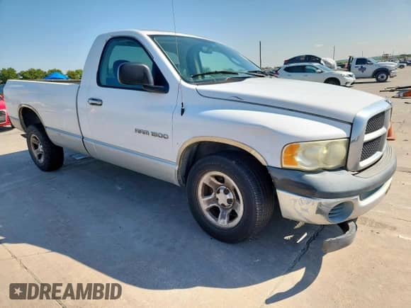 2003 Dodge 1500 ST with VIN 1D7HA16K03J517012, listed as a Copart auction lot 82157155 with 201,443 mi miles and Salvage title. Bid and sale history available at DreamBid. Image 4.