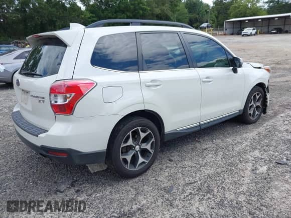 2016 Subaru Forester XT Touring z VIN JF2SJGXC4GH486064, wystawiony jako IAAI lot #42801023 z przebiegiem 134 785 mil mil oraz . Historia ofert i sprzedaży dostępna na DreamBid. Obrazek 4.
