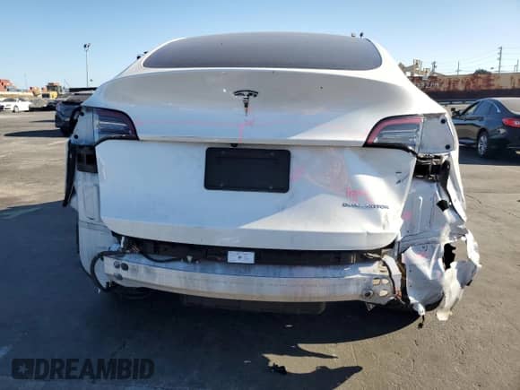 2023 Tesla Model Y Long Range with VIN 7SAYGDEE8PA093209, listed as a Copart auction lot 80299485 with 90,434 mi miles and Salvage title. Bid and sale history available at DreamBid. Image 6.