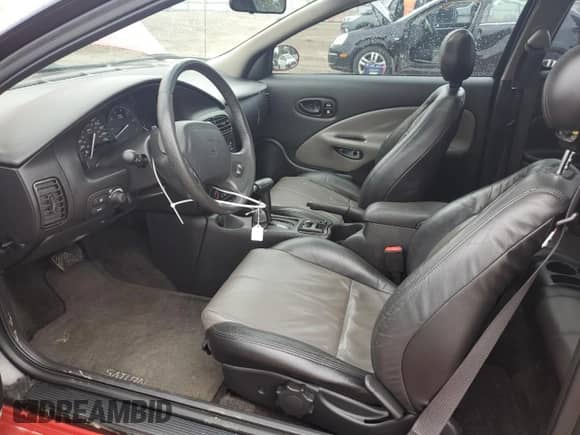 2002 Saturn SC with VIN 1G8ZY14732Z215717, listed as a Copart auction lot 57707765 with 85,232 mi miles and Salvage title. Bid and sale history available at DreamBid. Image 7.