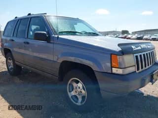1996 Jeep Grand Cherokee with VIN 1J4EZ58S5TC149533, listed as a IAAI auction lot 42456529 with 173,872 mi miles and . Bid and sale history available at DreamBid. Image 1.