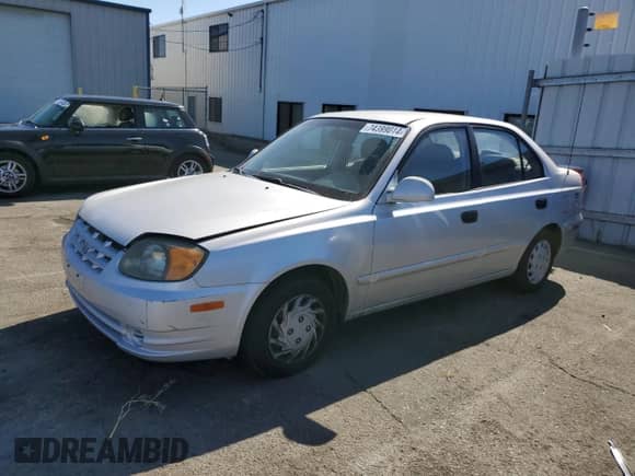 2003 Hyundai Accent GL с VIN KMHCG45CX3U488238, выставлен на аукционе Copart как лот 74399014 с пробегом 130 915 миль миль и Чистый • Clean title. История ставок и продаж доступна на DreamBid. Изображение 1.