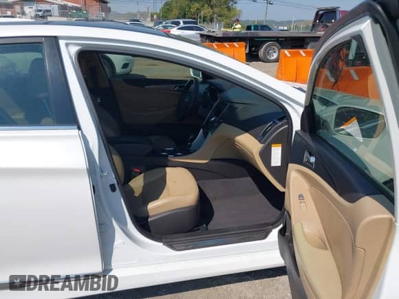 2015 Hyundai Sonata with VIN KMHEC4A45FA130554, listed as a IAAI auction lot 43214594 with 145,856 mi miles and . Bid and sale history available at DreamBid. Image 5.