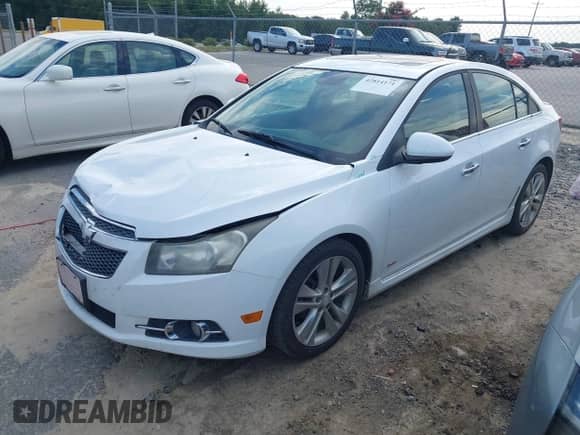 2013 Chevrolet Cruze LTZ z VIN 1G1PG5SB7D7224670, wystawiony jako IAAI lot #42814171 z przebiegiem 189 170 mil mil oraz . Historia ofert i sprzedaży dostępna na DreamBid. Obrazek 2.