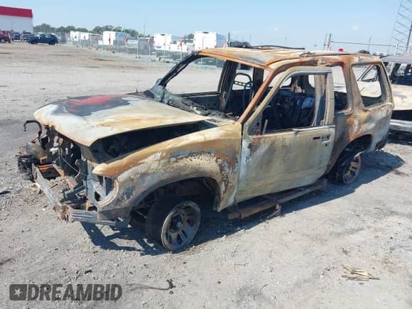 1999 Ford Explorer z VIN 1FMYU22E5XUB56559, wystawiony jako IAAI lot #43331856 z przebiegiem Nie podano mil oraz . Historia ofert i sprzedaży dostępna na DreamBid. Obrazek 2.