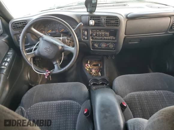 1999 Chevrolet Blazer LS z VIN 1GNCS13W1X2162495, wystawiony jako Copart lot #80019274 z przebiegiem Nie podano mil oraz Szkoda całkowita • Salvage title. Historia ofert i sprzedaży dostępna na DreamBid. Obrazek 8.