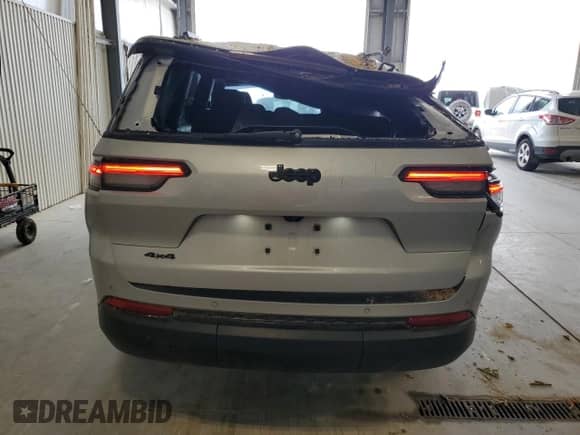 2023 Jeep Grand Cherokee Laredo with VIN 1C4RJKAG7P8854748, listed as a Copart auction lot 70170685 with 25,719 mi miles and Salvage title. Bid and sale history available at DreamBid. Image 6.