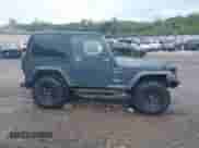 2002 Jeep Wrangler Sport z VIN 1J4FA49S02P708112, wystawiony jako IAAI lot #43374001 z przebiegiem 252 386 mil mil oraz . Historia ofert i sprzedaży dostępna na DreamBid. Obrazek 13.