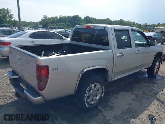 2011 Chevrolet Colorado 1LT z VIN 1GCHTCFEXB8131732, wystawiony jako IAAI lot #42595193 z przebiegiem 129 689 mil mil oraz . Historia ofert i sprzedaży dostępna na DreamBid. Obrazek 4.