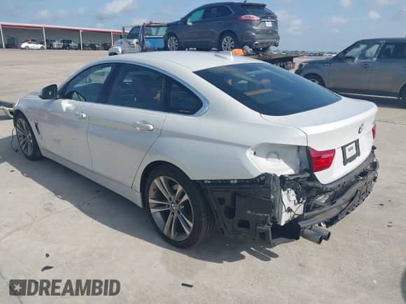 2016 BMW 4 Series 428i with VIN WBA4A9C58GG695174, listed as a IAAI auction lot 42721617 with 91,009 mi miles and . Bid and sale history available at DreamBid. Image 3.