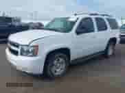 2013 Chevrolet Tahoe LS with VIN 1GNSCAE00DR266240, listed as a IAAI auction lot 42666283 with 144,846 mi miles and . Bid and sale history available at DreamBid. Image 2.