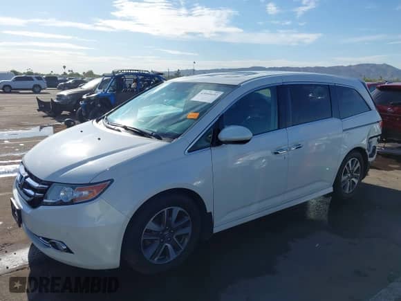 2015 Honda Odyssey Touring Elite с VIN 5FNRL5H94FB052272, выставлен на аукционе IAAI как лот 43040692 с пробегом 134 921 миль миль и . История ставок и продаж доступна на DreamBid. Изображение 18.