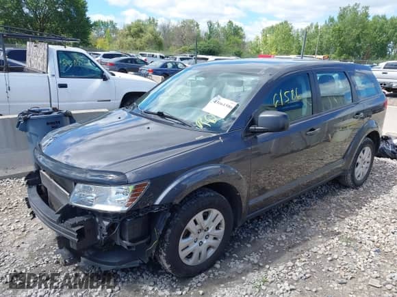2015 Dodge Journey SE with VIN 3C4PDCAB4FT654791, listed as a IAAI auction lot 43061586 with 131,671 mi miles and . Bid and sale history available at DreamBid. Image 2.