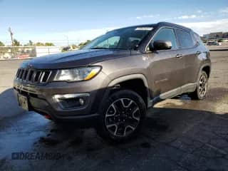 2021 Jeep Compass Trailhawk with VIN 3C4NJDDB6MT571622, listed as a Copart auction lot 83764945 with 129,810 mi miles and Clean title. Bid and sale history available at DreamBid. Image 1.