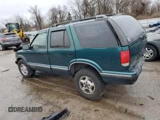 1997 Chevrolet Blazer LS с VIN 1GNDT13W1V2254432, выставлен на аукционе Copart как лот 74691234 с пробегом 136 331 миль миль и Списание • Salvage title. История ставок и продаж доступна на DreamBid. Изображение 2.