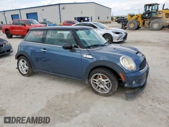 2010 MINI Hardtop S with VIN WMWMF7C51ATZ69061, listed as a Copart auction lot 60837465 with 102,506 mi miles and Salvage title. Bid and sale history available at DreamBid. Image 4.