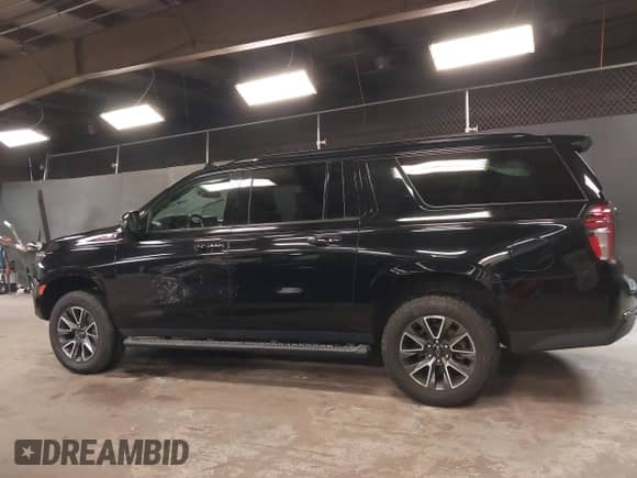 2021 Chevrolet Suburban Z71 with VIN 1GNSKDKD3MR140935, listed as a IAAI auction lot 42345178 with 52,370 mi miles and . Bid and sale history available at DreamBid. Image 14.