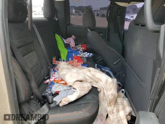 2023 Nissan Frontier Pro-4X z VIN 1N6ED1EK0PN617872, wystawiony jako Copart lot #57125435 z przebiegiem 97 981 mil mil oraz Szkoda całkowita • Salvage title. Historia ofert i sprzedaży dostępna na DreamBid. Obrazek 10.