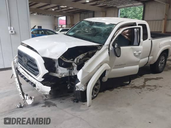 2018 Toyota Tacoma SR5 with VIN 5TFRZ5CN2JX058282, listed as a IAAI auction lot 42633438 with 94,071 mi miles and . Bid and sale history available at DreamBid. Image 6.