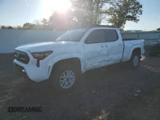 2024 Toyota Tacoma SR5 with VIN 3TYLB5JN6RT040080, listed as a Copart auction lot 86147085 with 7,596 mi miles and Salvage title. Bid and sale history available at DreamBid. Image 1.