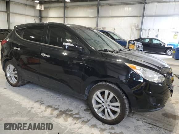 2012 Hyundai Tucson Limited z VIN KM8JUCAC2CU405336, wystawiony jako Copart lot #90353775 z przebiegiem 83 563 mil mil oraz Szkoda całkowita • Salvage title. Historia ofert i sprzedaży dostępna na DreamBid. Obrazek 4.