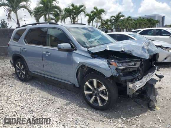 2023 Honda Pilot Touring с VIN 5FNYG2H75PB011423, выставлен на аукционе Copart как лот 60784185 с пробегом 8 214 миль миль и Списание • Salvage title. История ставок и продаж доступна на DreamBid. Изображение 4.