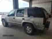 2000 Chevrolet Tahoe Z71 with VIN 1GNEK13RXYR137011, listed as a Copart auction lot 63754865 with 151,766 mi miles and Salvage title. Bid and sale history available at DreamBid. Image 2.