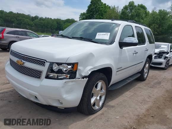 2012 Chevrolet Tahoe LTZ with VIN 1GNSKCE05CR177535, listed as a IAAI auction lot 42149054 with 184,830 mi miles and . Bid and sale history available at DreamBid. Image 2.