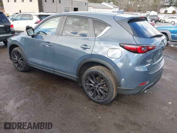 2022 Mazda CX-5 S Carbon Edition z VIN JM3KFBCM7N0579780, wystawiony jako IAAI lot #41460860 z przebiegiem 43 479 mil mil oraz . Historia ofert i sprzedaży dostępna na DreamBid. Obrazek 3.