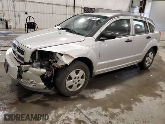 2009 Dodge Caliber SE with VIN 1B3HB28A99D108193, listed as a Copart auction lot 43604395 with 112,899 mi miles and Salvage title. Bid and sale history available at DreamBid. Image 1.
