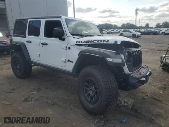 2022 Jeep Wrangler Unlimited Rubicon with VIN 1C4JJXFG6NW124065, listed as a Copart auction lot 67817425 with 60,324 mi miles and Salvage title. Bid and sale history available at DreamBid. Image 4.