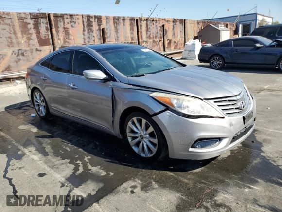 2013 Hyundai Azera z VIN KMHFH4JGXDA245194, wystawiony jako Copart lot #77252934 z przebiegiem 128 712 mil mil oraz Czysty tytuł • Clean title. Historia ofert i sprzedaży dostępna na DreamBid. Obrazek 4.